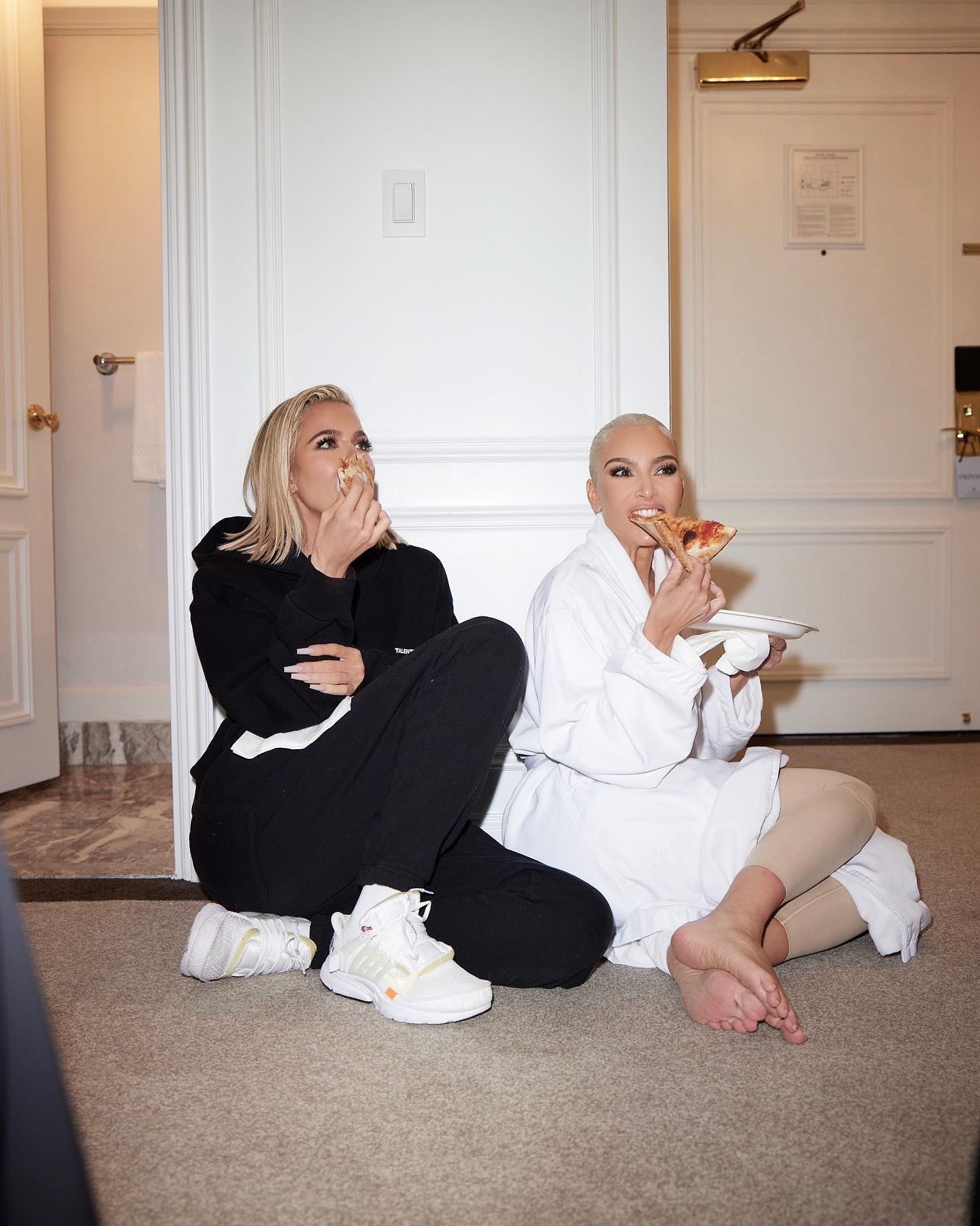 She was accused of 'pretending' to eat pizza in this photo with her sister Khloe